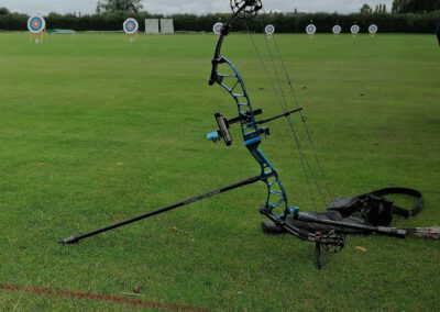 Compound bow in front of Archery targets